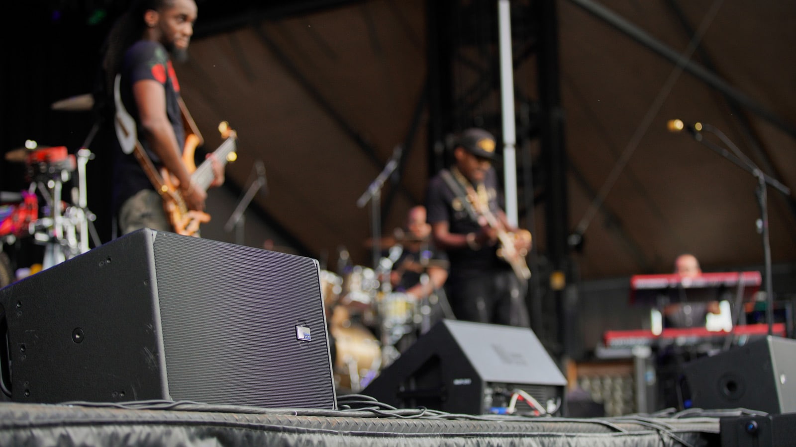 Eric Gales performs on the outdoor main stage at Trustees' Garden